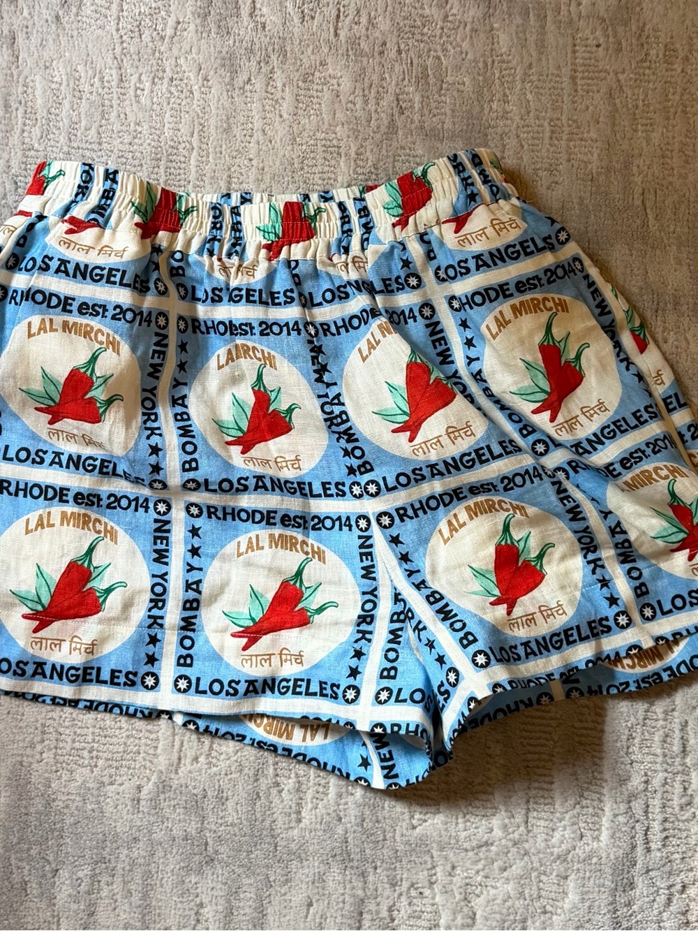 RHODE Light Blue Floral Print Shorts with Red Accents